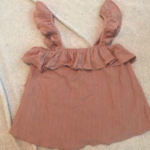 Blush, ruffled tank.
